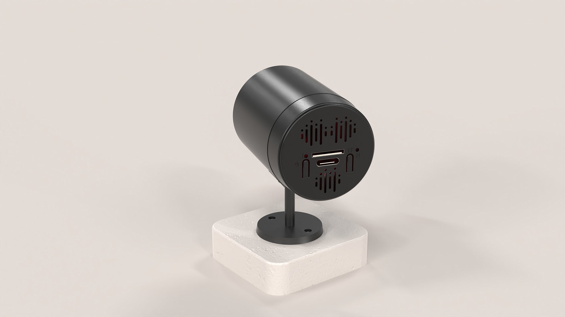 Black cylindrical device with ports on a white stand against a light gray background